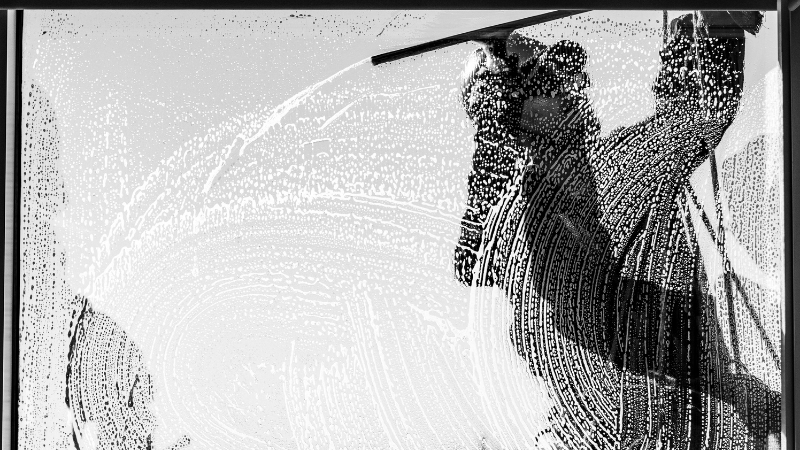 Window cleaning with squeegee leaving streak-free glass